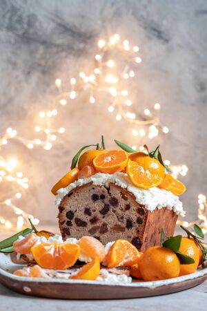 Christmas fruit cake decorated with a clementinesの写真素材