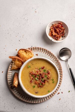 Lentil pea soup garnish with bacon and pork ribsの写真素材