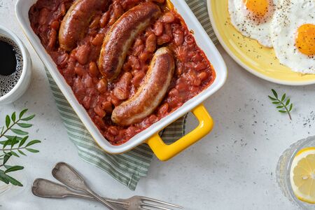 Baked beans in tomato sauce with sausagesの写真素材