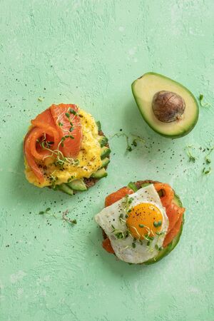 Scrambled eggs with smoked salmon and avocado on toast , Breakfast foodの写真素材
