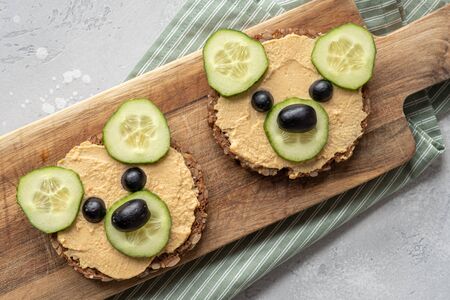 Funny bear toast with cucumber and hummus toastsの写真素材