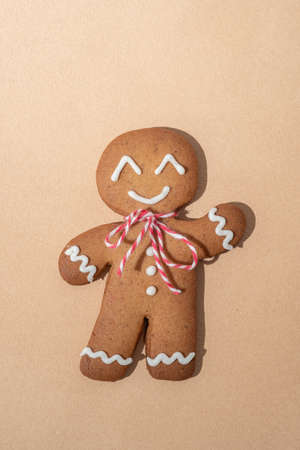 Gingerbread man isolated on beigeの写真素材