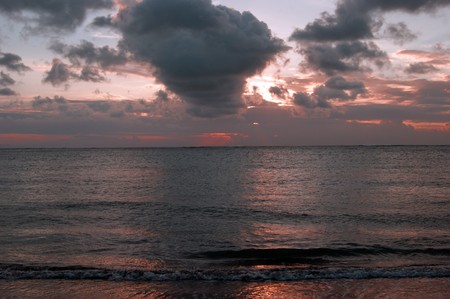 Sunset at coast Bali about the city of Kuta.の写真素材