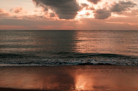 Sunset at coast Bali about the city of Kuta.の写真素材