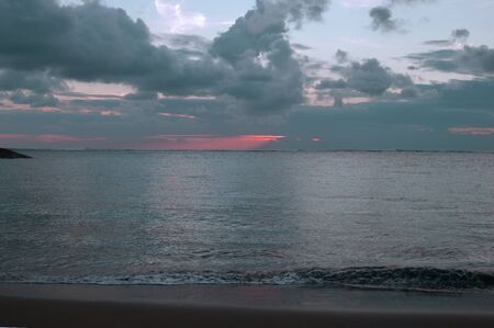 Sunset at coast Bali about the city of Kuta.の写真素材