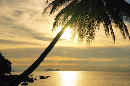 Landscape of natural sandy beaches of coast Southern - the Chinese sea of peninsula Seantubong to Borneo. Sunset.の写真素材