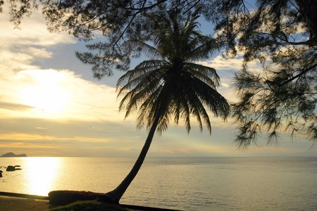 Landscape of natural sandy beaches of coast Southern - the Chinese sea of peninsula Seantubong to Borneo. Sunset.の写真素材