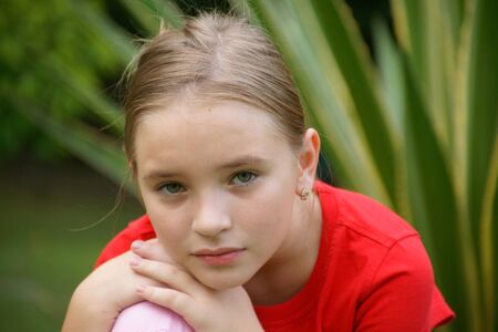 The beautiful girl walks in tropical park to Borneo.