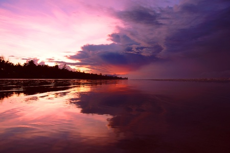 Sea sunset at stony sea coast of Rambungan. Borneo. 