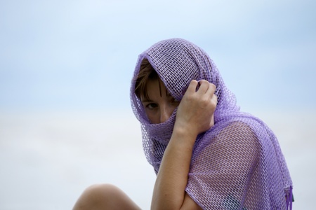 The young beautiful girl in a bathing suit bathes in South China sea on island Borneo peninsula Santubong.の写真素材