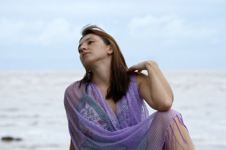 The young beautiful girl in a bathing suit bathes in South China sea on island Borneo peninsula Santubong.の写真素材