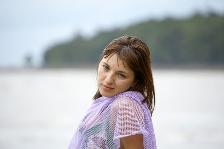 The young beautiful girl in a bathing suit bathes in South China sea on island Borneo peninsula Santubong.の写真素材