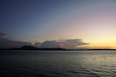 Sea sunset at stony sea coast of island Borneo. の写真素材