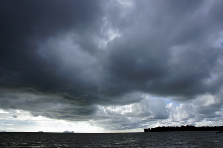 The dark blue sea of the stony coast of Borneo. 