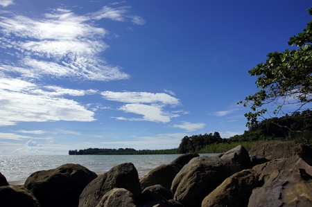 Hot South China sea washes coast Borneo.