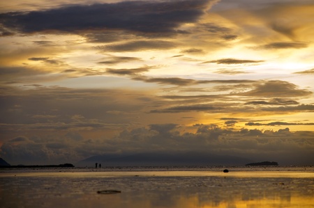 Sea sunset at stony sea coast of peninsula Santubong. Borneo. 