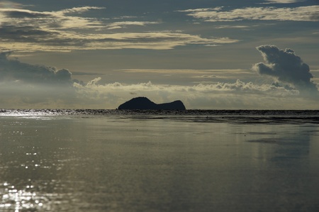 Sea sunset at stony sea coast of peninsula Santubong. Borneo. 