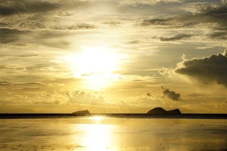 Sea sunset at stony sea coast of peninsula Santubong. Borneo. の写真素材