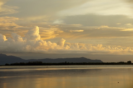 Sea sunset at stony sea coast of peninsula Santubong. Borneo. 