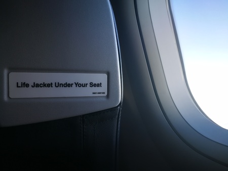 a storm cloud in the sky from airplane windows viewの写真素材