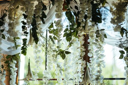 white flowers hanging on the ceilingの写真素材