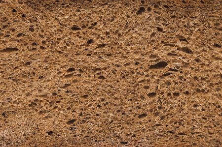freshly baked rye bread with bran and cereal seeds: texture close-upの写真素材