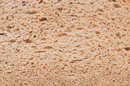freshly baked bread with bran and cereal seeds: texture close-upの写真素材