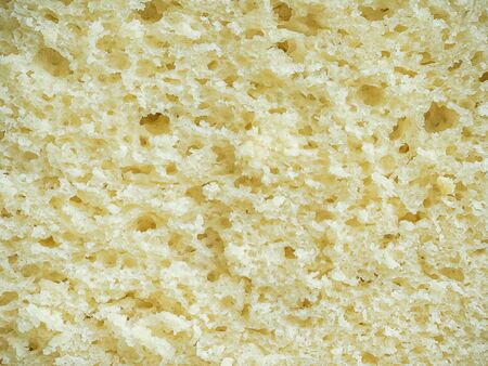 texture of yellow corn bread cutaway closeup - food backgroundの写真素材