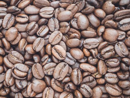 a lot of coffee beans medium roasted - food backgroundの写真素材