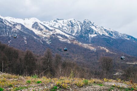 cable car in the snowy mountains in springの写真素材