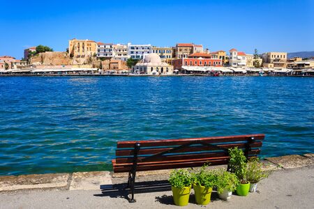 Rethymnon, Crete, Greece - August 15, 2015: bench overlooking the Venetian port of Rethymnonのeditorial素材