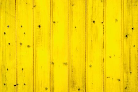 yellow painted wooden planks closeup - texture for designの写真素材