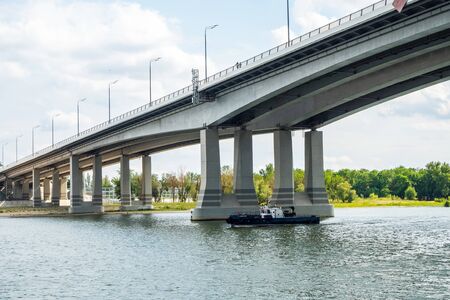 Rostov-on-Don, Russia - July, 2019: the ship sails along the Don River and passes under the Voroshilovsky Bridgeの写真素材