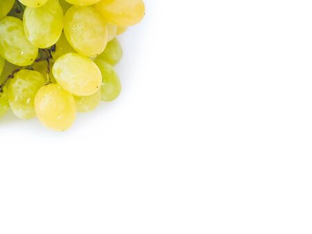 brush of ripe Kishmish grapes with drops of water on a white background close-up isolated on whiteの写真素材