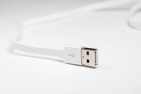 white long cable usb on white background in studio close upの写真素材
