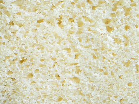 texture of yellow corn bread cutaway closeup - food backgroundの写真素材