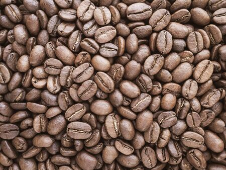 a lot of coffee beans medium roasted - food backgroundの写真素材