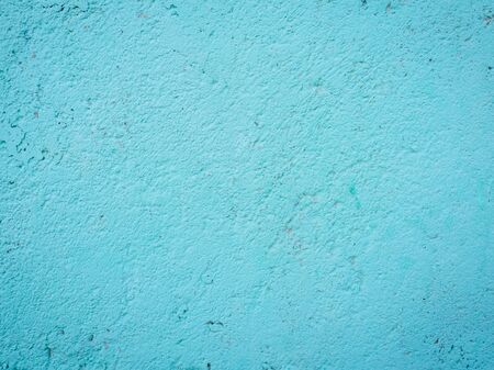 texture painted with white paint concrete wall with chippedの写真素材