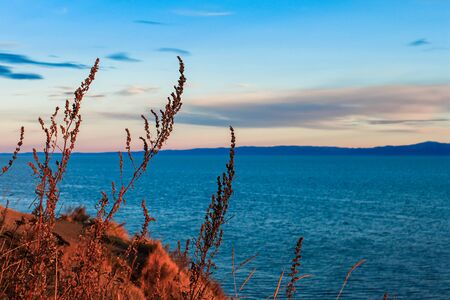 Sunset on lake baikal. Autumn.の写真素材