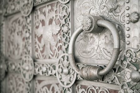 handle on the ancient wrought gateの写真素材