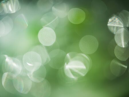 large bokeh with jagged circles - green background out of focusの写真素材