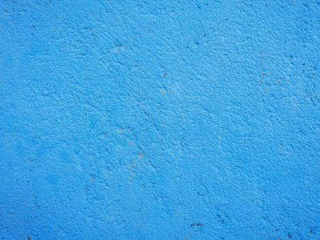 texture painted with white paint concrete wall with chippedの写真素材
