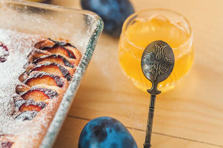 antique teaspoon near a crystal vase with honey close-up, curd plum cakeの写真素材