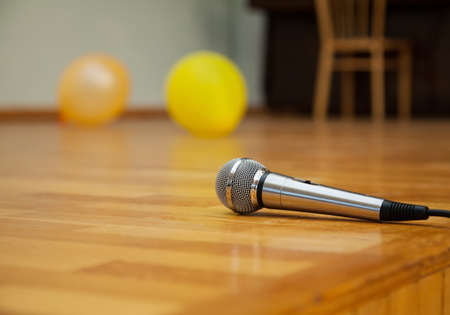 microphone on the wooden floor of the stage - the concert is overの写真素材