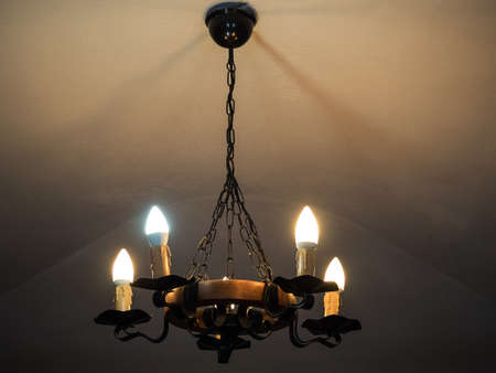 vintage chandelier shines in the dark in the castleの写真素材
