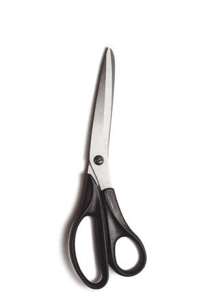 metal tailor sewing scissors with black big and small rings on white background isolated with shadowの写真素材