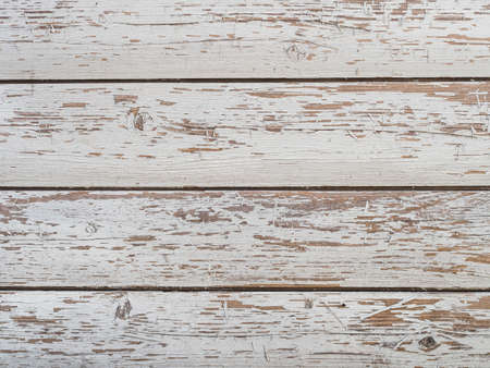 old boards painted white, peeling paint - horizontal backgroundの写真素材