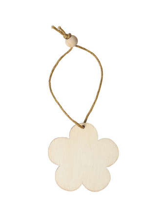wooden christmas toy in the form of a flower on a white background isolatedの写真素材