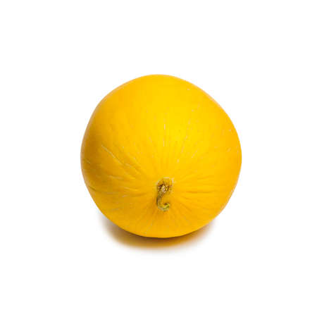 yellow unpeeled melon close up isolated on white with shadowの写真素材