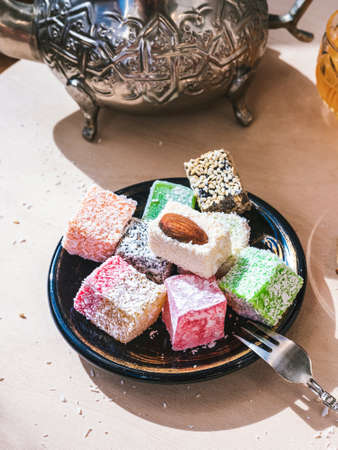a plate with Arabian sweets - Turkish delight with different flavorsの写真素材